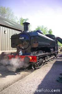 A plain black steam engine hidden in the Dean Forest. On the Dean Forest Railway.